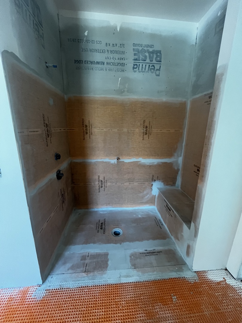 Shower installation showing Schluter Kerdi membrane on walls alongside cement board substrate - KV Tileworks