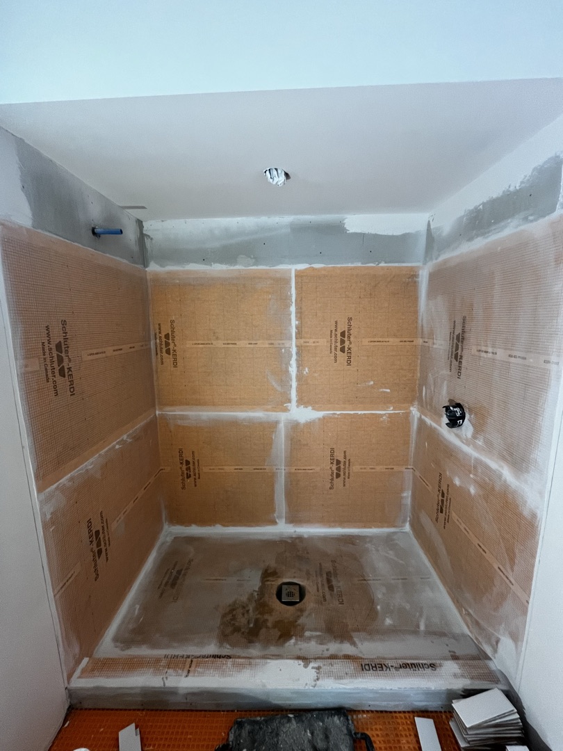 Schluter Kerdi waterproofing membrane installed on all shower walls and floor pan, ready for tile - KV Tileworks